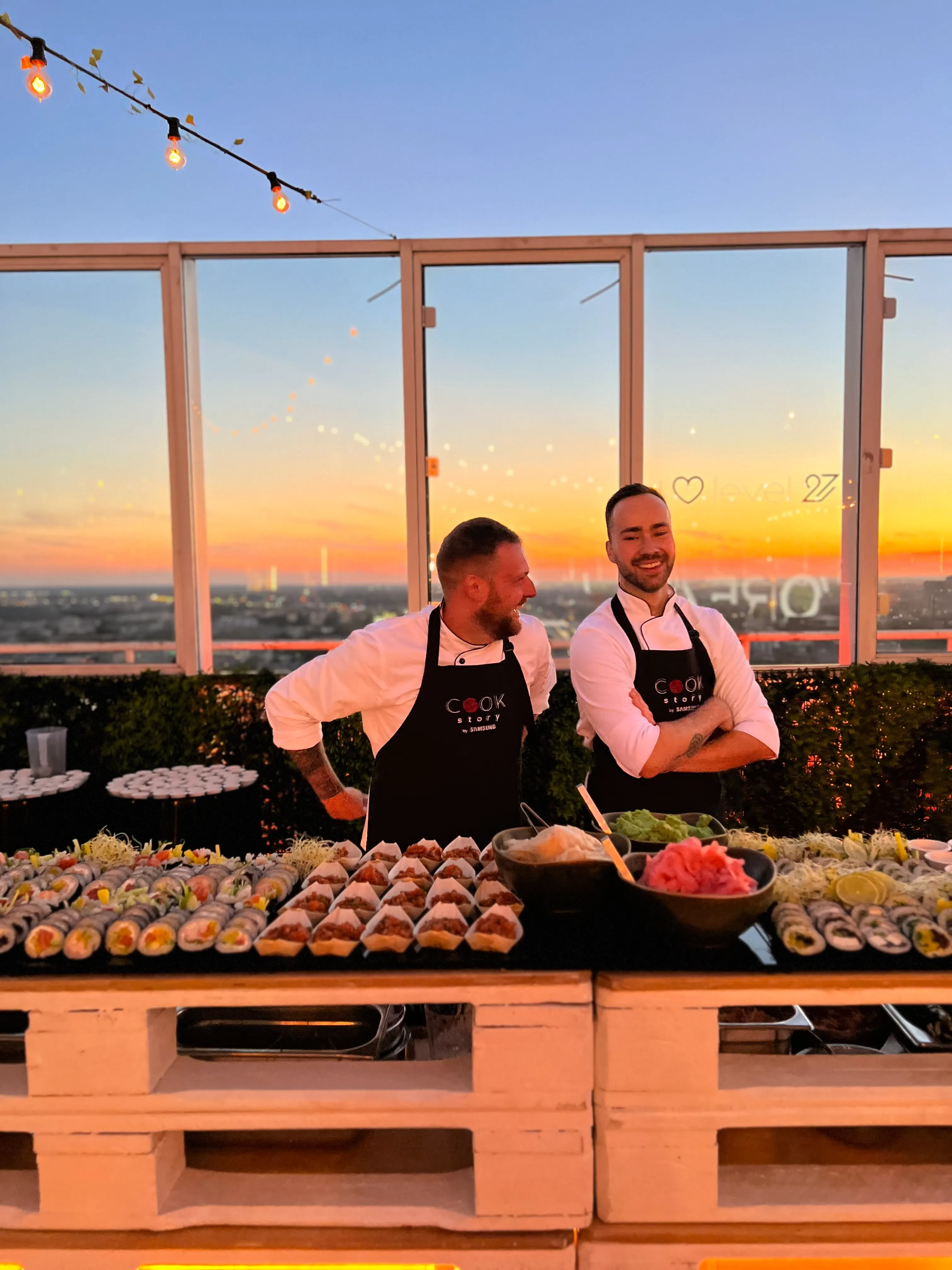 Culinary Affairs — chefs serving rooftop dinner at sunset